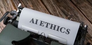 Maszyna do pisania z kartką AI Ethics, symbol etyki sztucznej inteligencji
